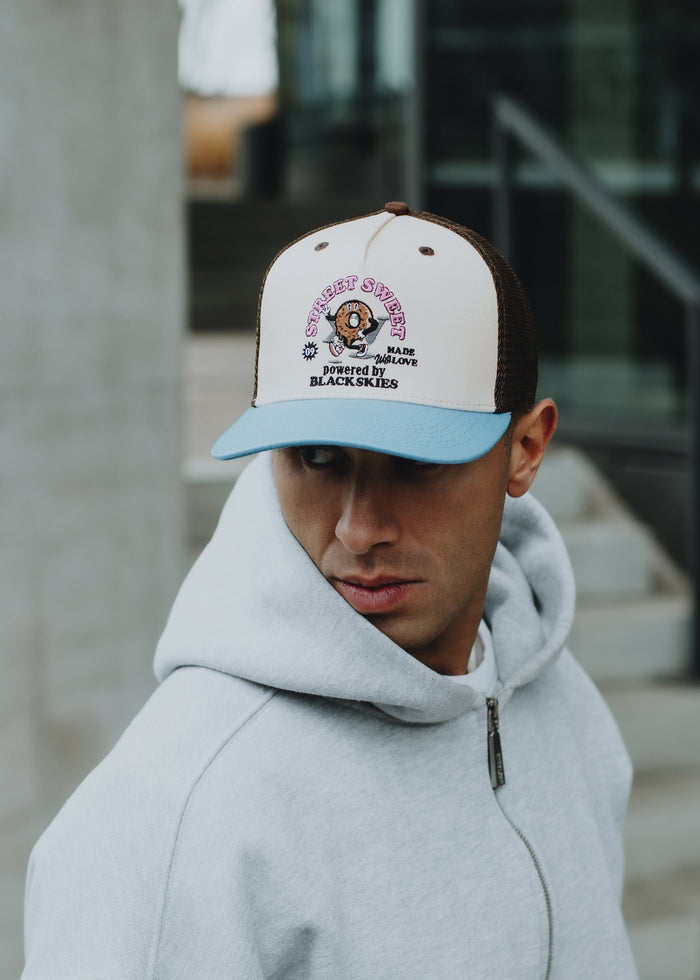 Blackskies-15th-Anniversary-Trucker-Cap-Donut-Model