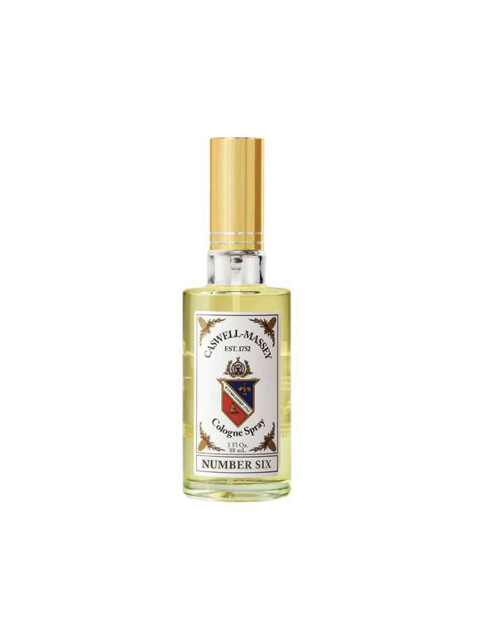 Close-up of Number Six Cologne spray bottle with gold cap, citrus woody scent