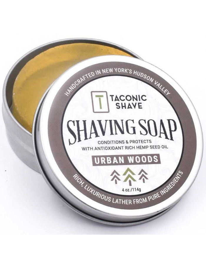 Open Taconic Urban Woods shaving soap tin with golden soap inside